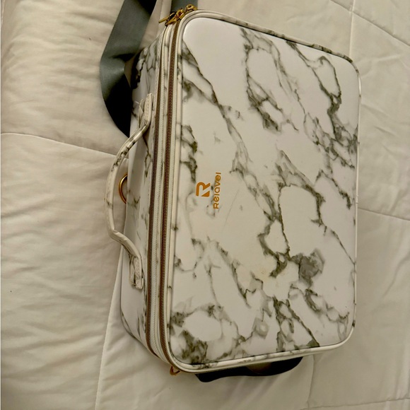 has attachable strap, organizers, holds makeup brushes. many zips & compartments - Picture 1 of 3
